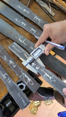 Inspection and testing of steel plate specimens